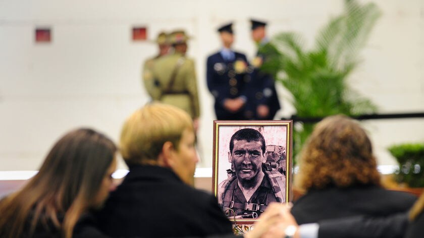 The family of Commando Private Scott Palmer at a memorial ceremony in Sydney. June 26, 2010.