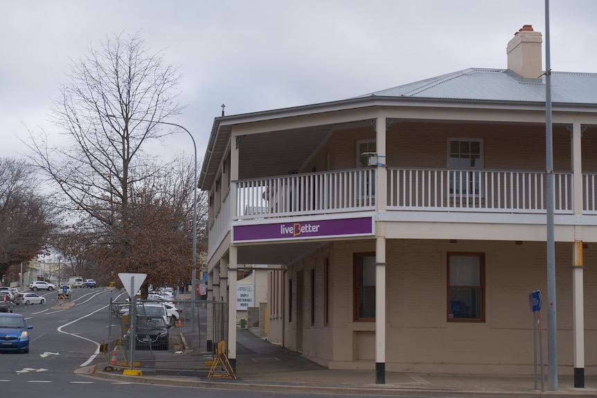 Two storey building with a purple sign that says LiveBetter