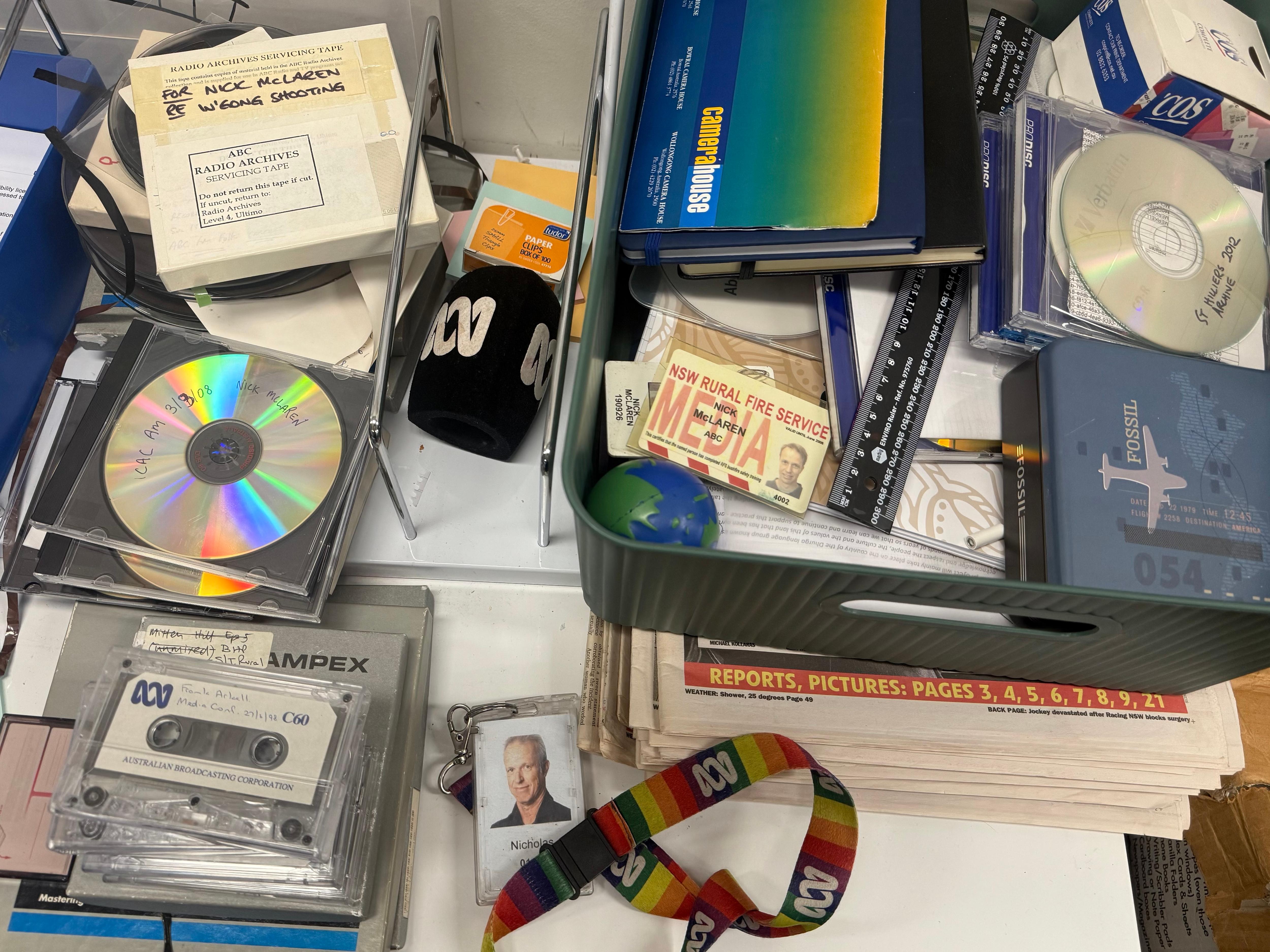 CDs, tapes, IDs and a microphone with an ABC symbol.