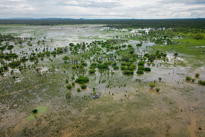 An aerial image of an airboat travelling across a flood plain in Kakadu National Park.