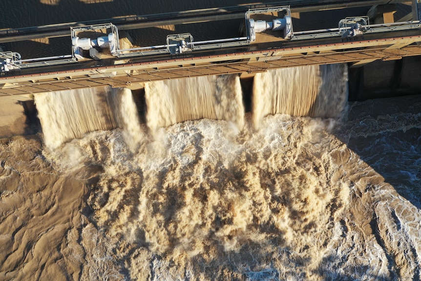 A drone shot of water spilling from Beardmore dam 