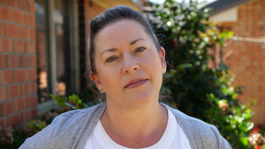 Woman wearing a white shirt in a garden