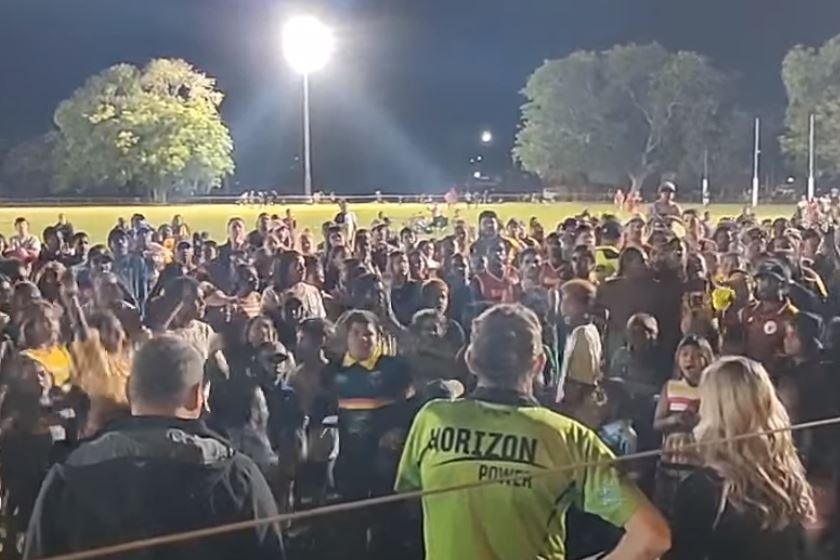 a crowd questions officials after the grand final was beset by a scandal around a drunk goal umpire
