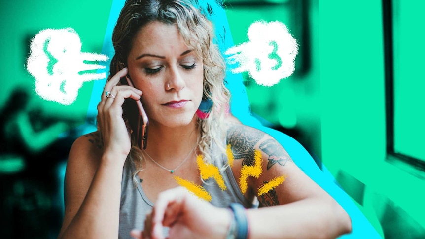 Woman on her mobile phone looks at the time on her wrist watch for a story about rudeness and stress telemarketers experience.