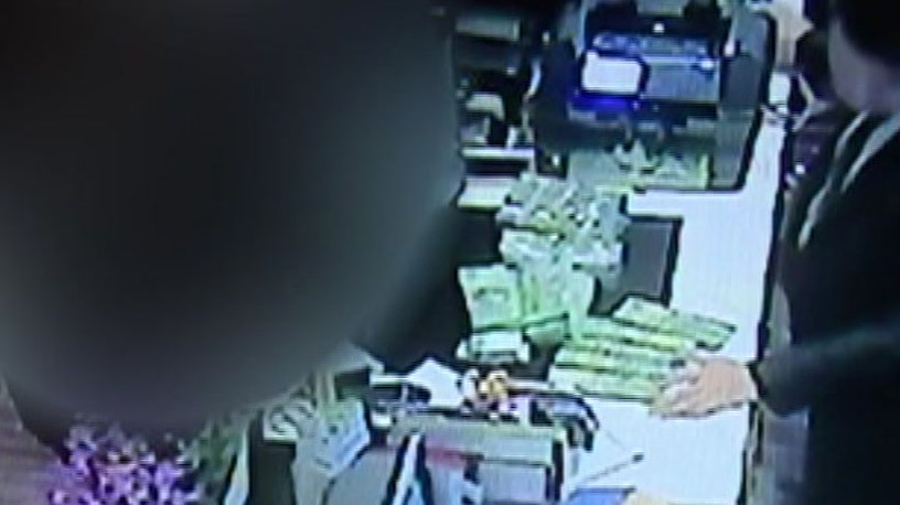 CCTV footage showing a man exchanging cash for gambling chips.