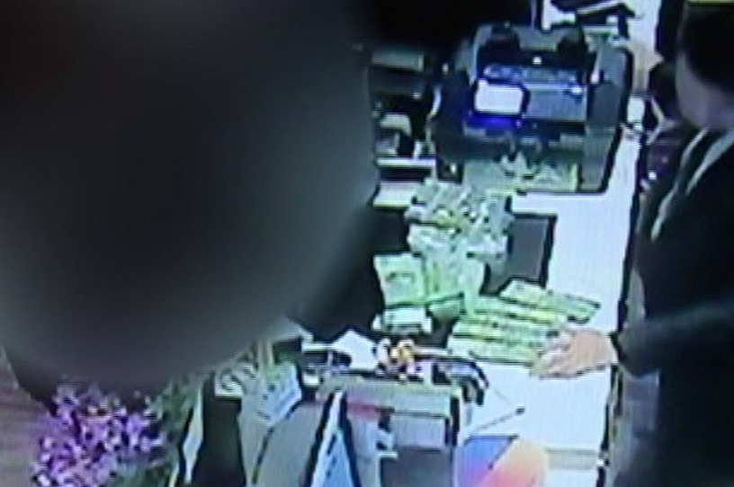 CCTV footage showing a man exchanging cash for gambling chips.