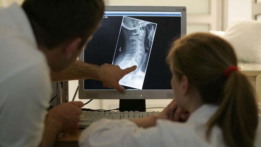 Doctors look at an X-ray image