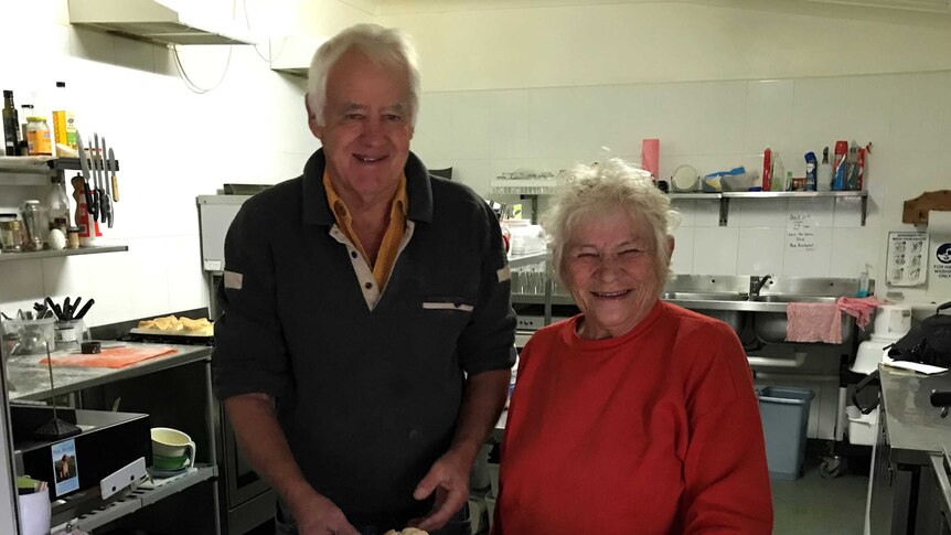 Barry Devitt and Di Studdert and a tray of scones made in the kitchen at Moorland Cottage at Taree in NSW.