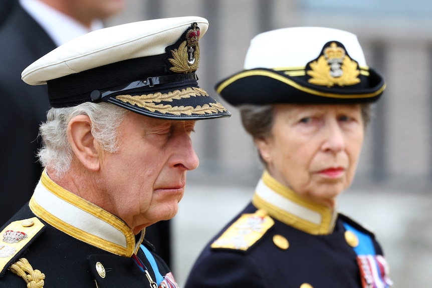 Britain's King Charles seems sad when Princess Anne watches him during the Queen's funeral. 