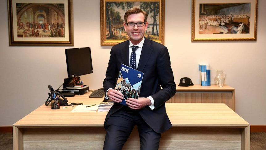 A man holds a book.