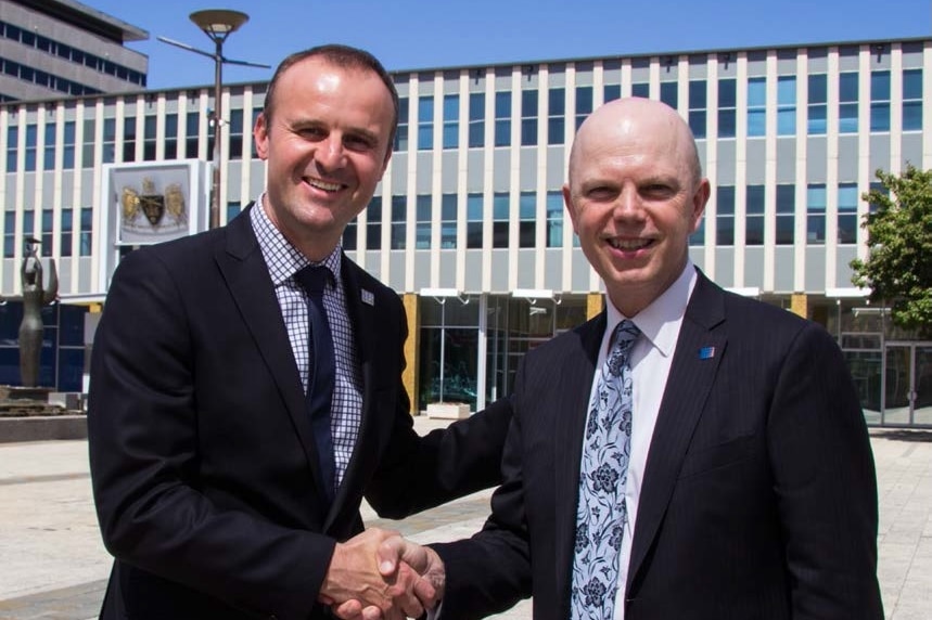 ACT Chief Minister Andrew Barr and Dexar Group CEO John Runko shake hands outside the Legislative Assembly.