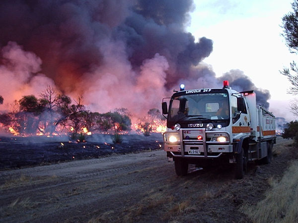 A fire truck stationed next to the Wangary bushfire as it burns