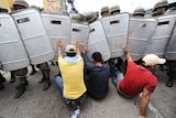 Soldiers try to remove supporters of Honduras' ousted President Manuel Zelaya from the streets