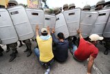 Soldiers try to remove supporters of Honduras' ousted President Manuel Zelaya from the streets