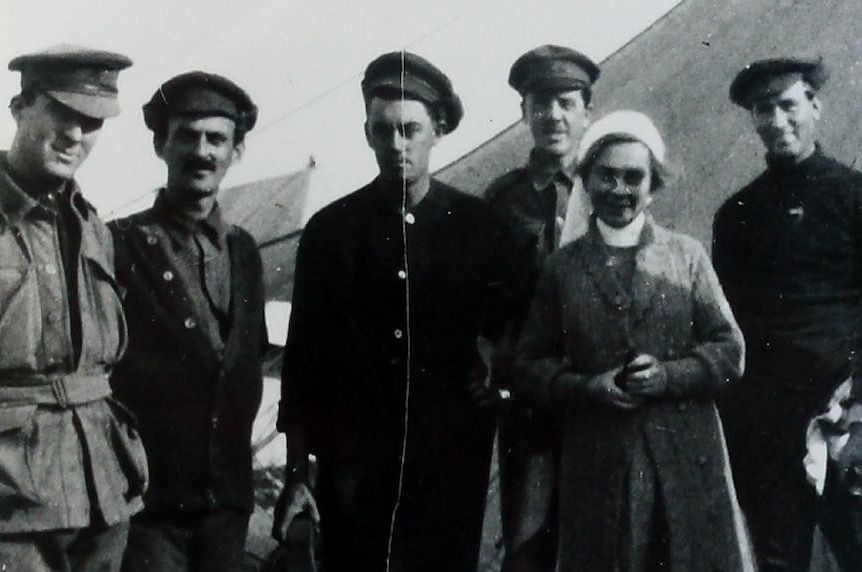 Anne Donnell pictured with Australian troops in National Library of Australia photo