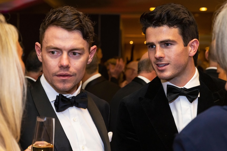 Lachie Neale and Andrew Brayshaw speak to each other on the Brownlow red carpet