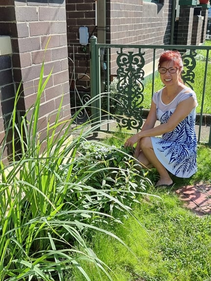 Thuy Dang next to her vegetables patch at Marrickville home (Feb 2022)