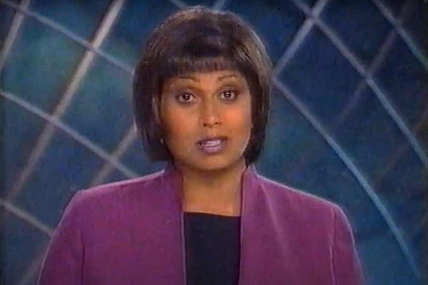 A female newsreader on TV.