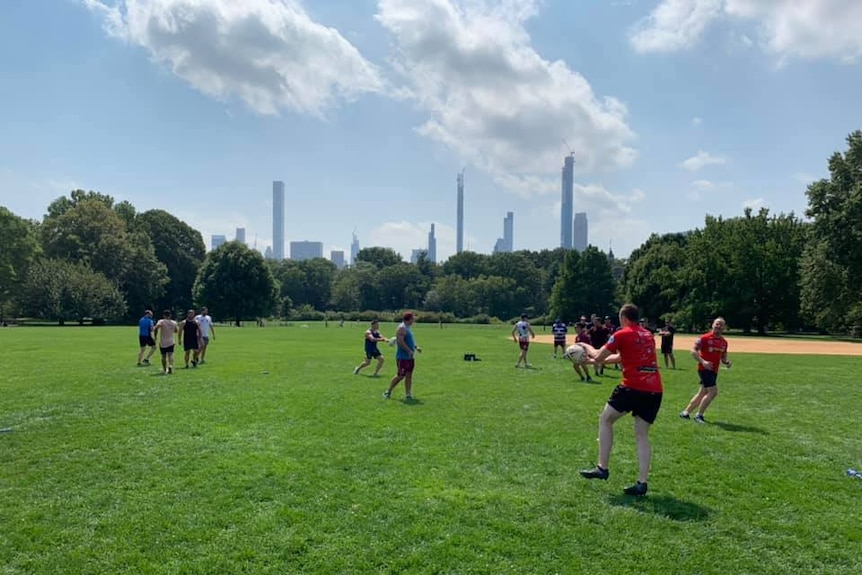 The teams train in front of the new york city skyline.
