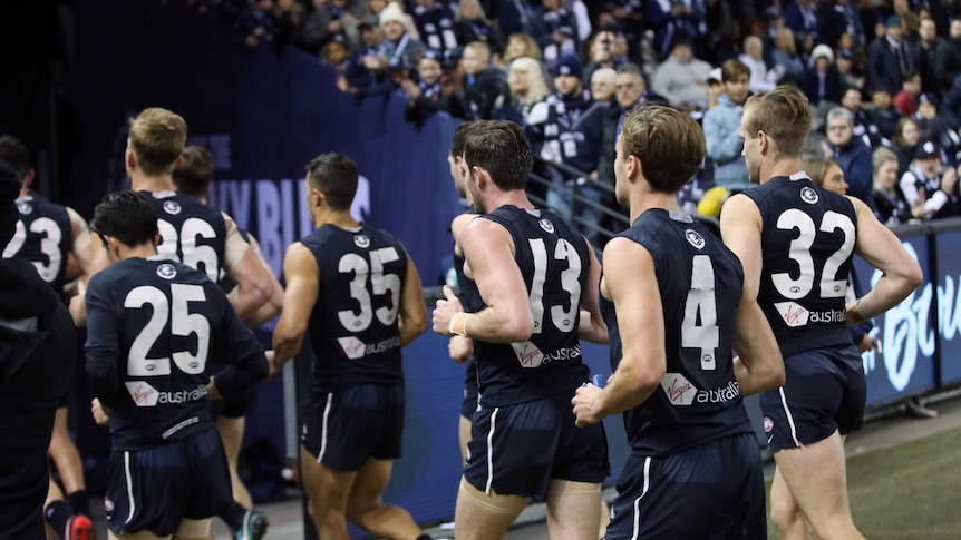 Carlton players leave the field at half time against Fremantle at Docklands on June 16, 2018.