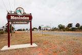Sign with Menindee written on it, on the side of a country road