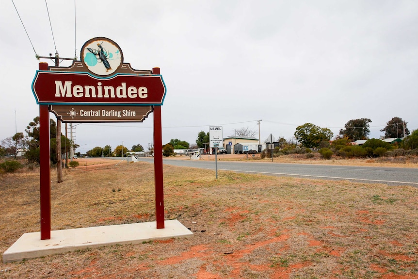 Sign with Menindee written on it, on the side of a country road