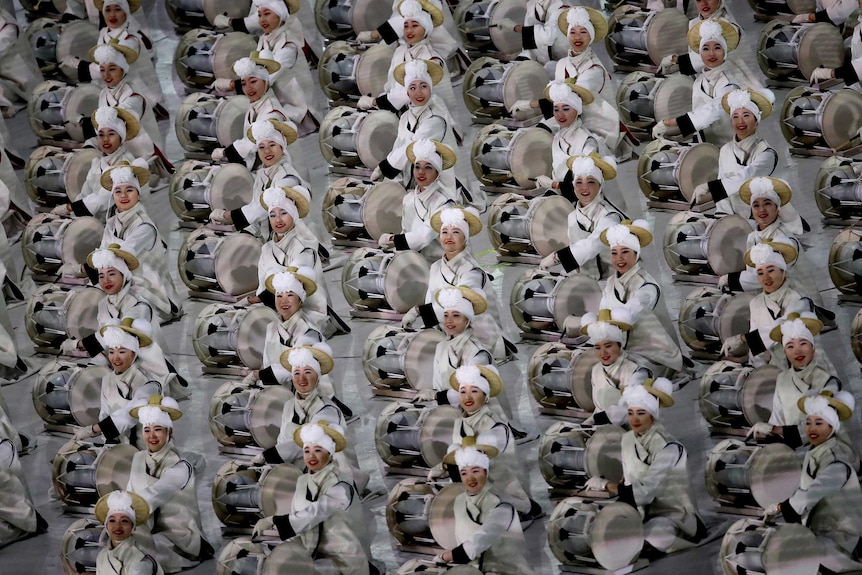Dozens of drummers perform in unison at the opening ceremony