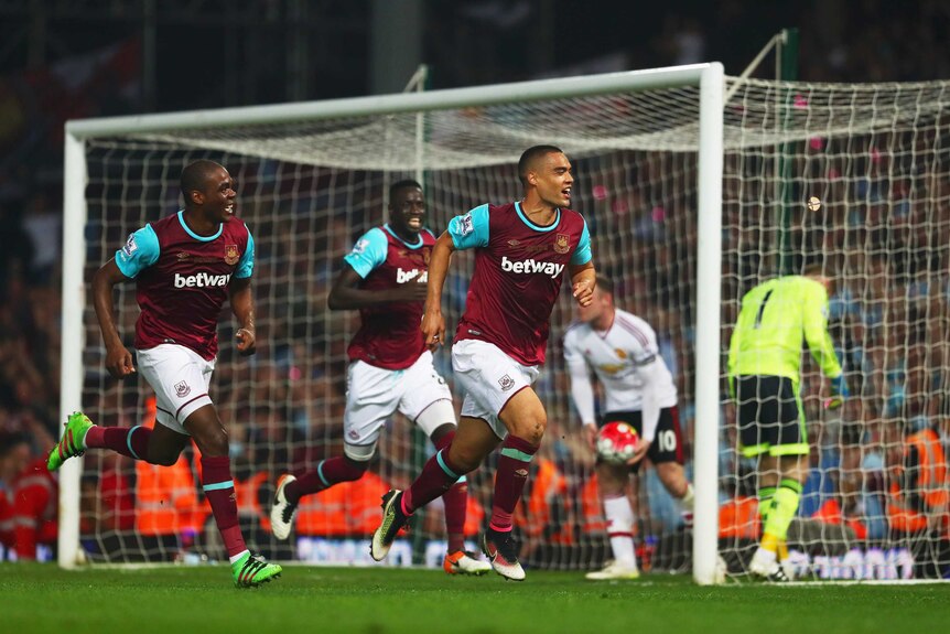 West Ham's Winston Reid celebrates with team-mates after his goal against Manchester United
