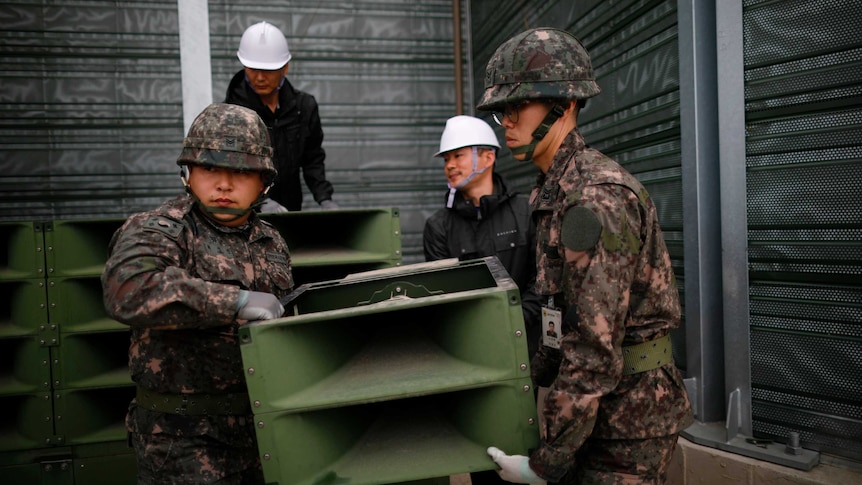 South Korean soldiers dismantle loudspeakers set up for propaganda broadcasts near the demilitarized zone.