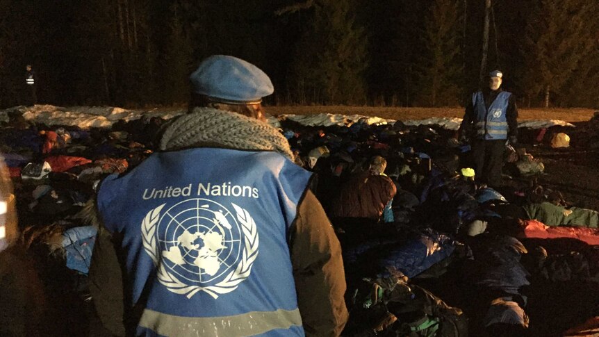 UN guards watch over sleeping children