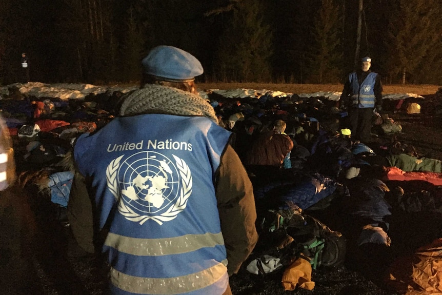 UN guards watch over sleeping children