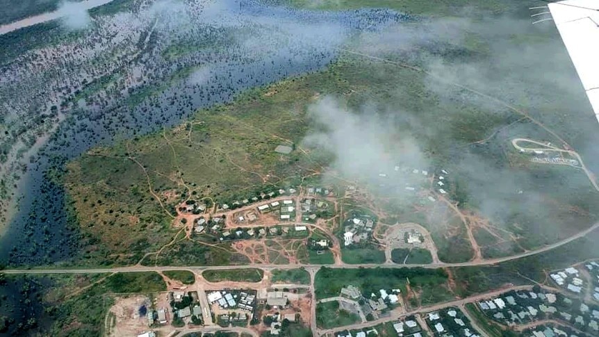 An aerial photo of Fitzroy Crossing surrounded by water.