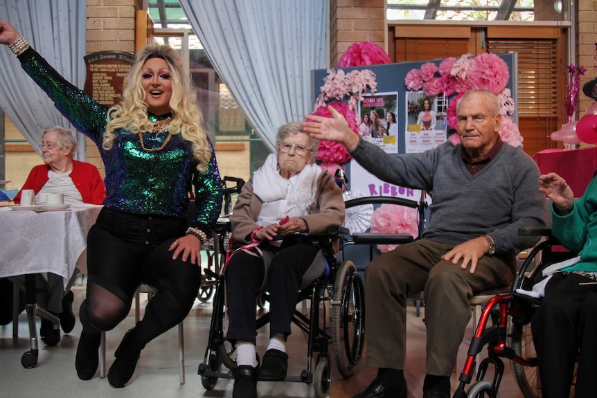 Tacky and two residents dancing.