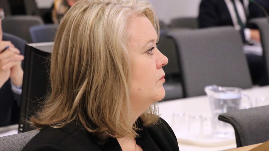 A side-on close-up shot of Kate Ellson seated during a hearing for the inquiry into the City of Perth.