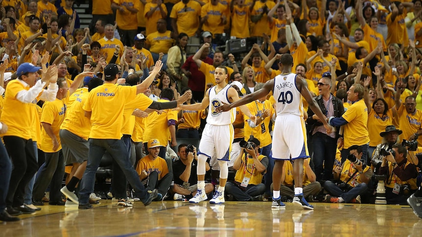 Golden State's Stephen Curry #30 and Harrison Barnes #40 celebrate against the San Antonio Spurs.
