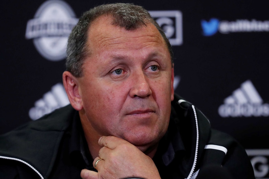 A New Zealand All Blacks assistant coach waits to answer a question at a media conference in London.