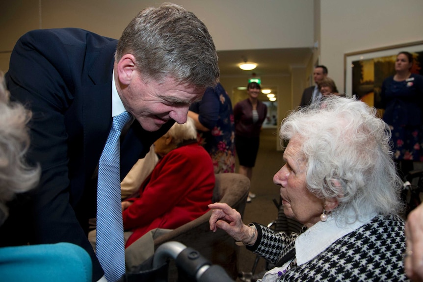 Bill English visits an elderly retirement home.