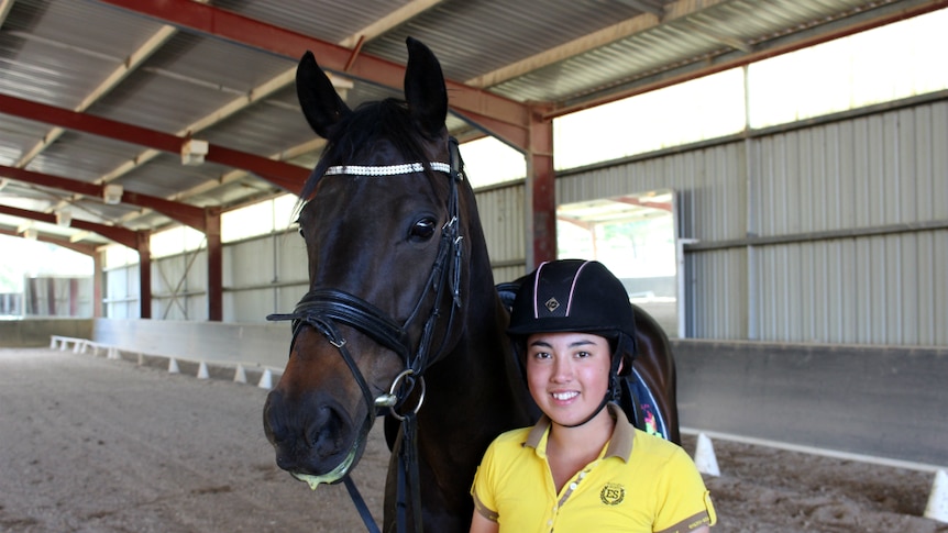Portrait of Heywire winner Emma Murray and her horse.