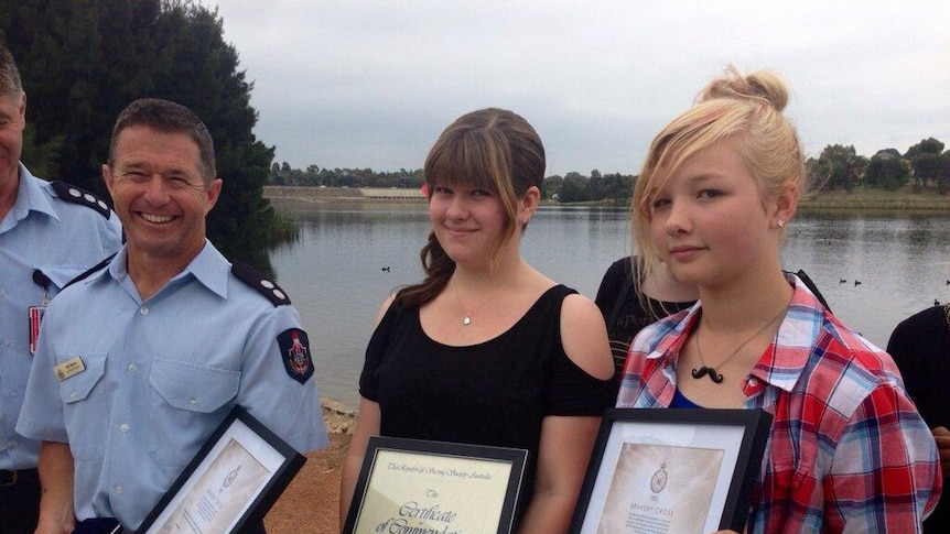 Neil Maher, Tessa Blight and Emily de Gier honoured for rescuing Zartash Sarwar from floodwaters at Yerrabi Ponds.