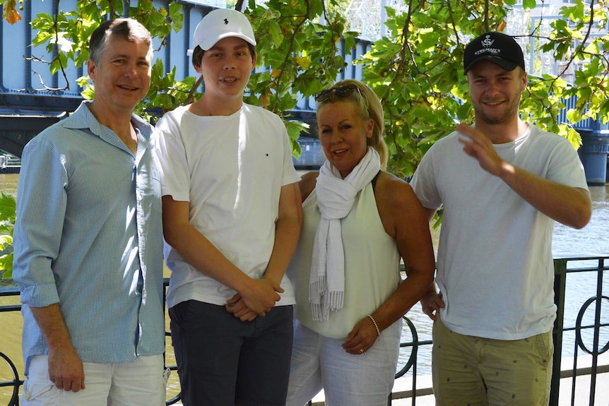 Colin, Cooper, Tania and Mitchell Rice-Brading stand under a tree.