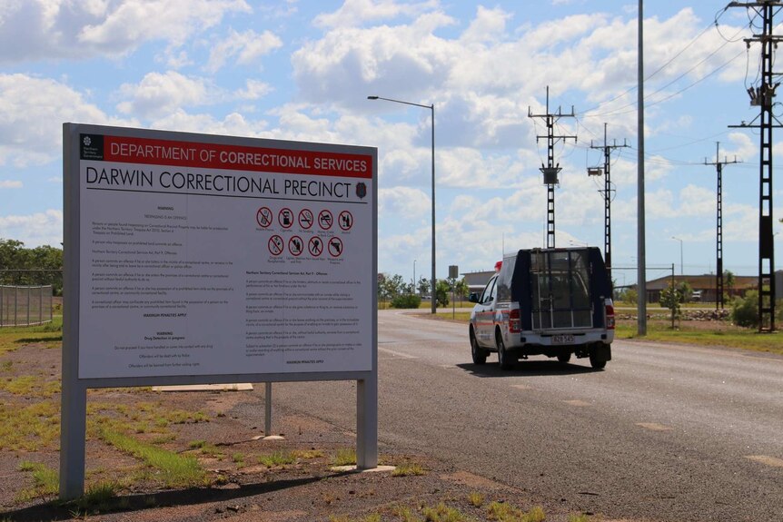 A police car enters Darwin's jail