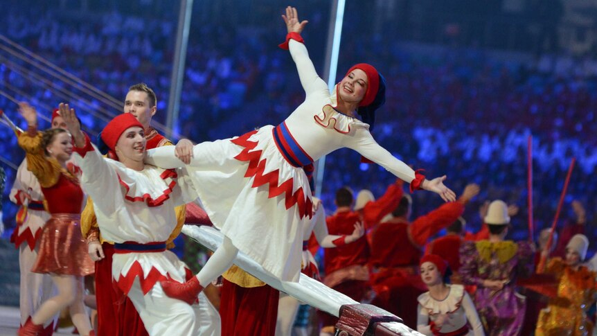 Acrobats perform at the Winter Olympics closing ceremony