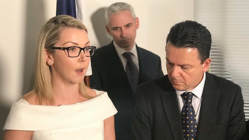 Senator Skye Kakoschke-Moore speaks at a press conference with her husband Simon and Nick Xenophon