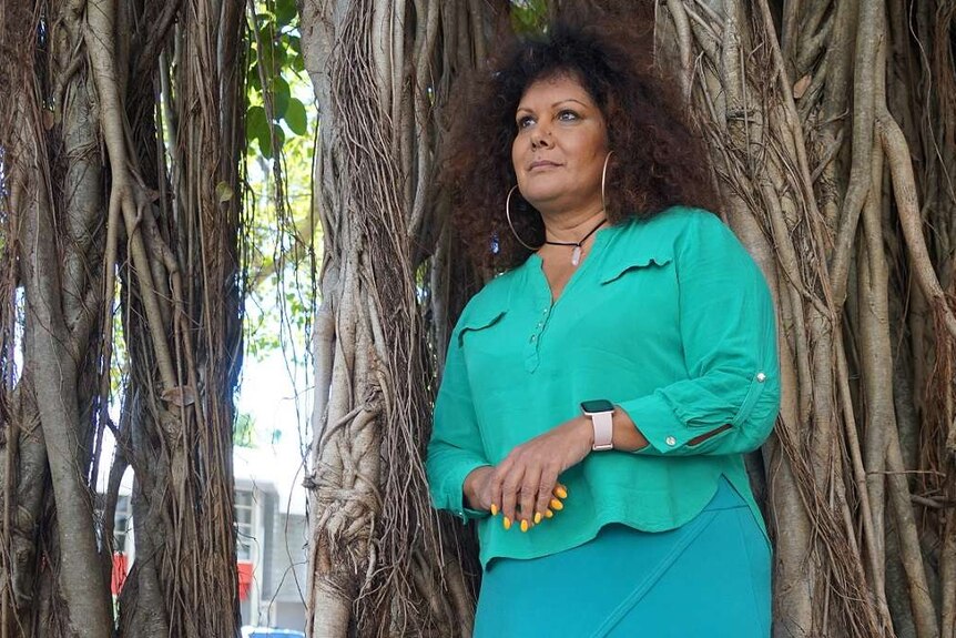 Malarndirri McCarthy stands in front a tree.