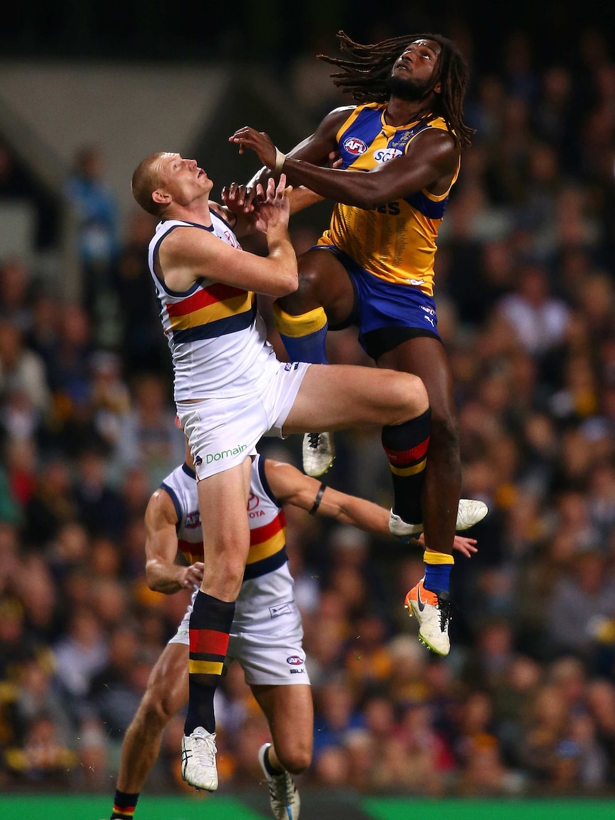 Sam Jacobs of the Crows and Nic Naitanui of the Eagles contest the ruck in an AFL game at Subiaco Oval.