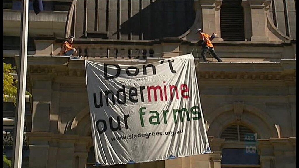 Men fined over Qld Parliament rooftop protest - ABC News