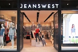 The front of a Jeanswest store with mannequins in the windows.