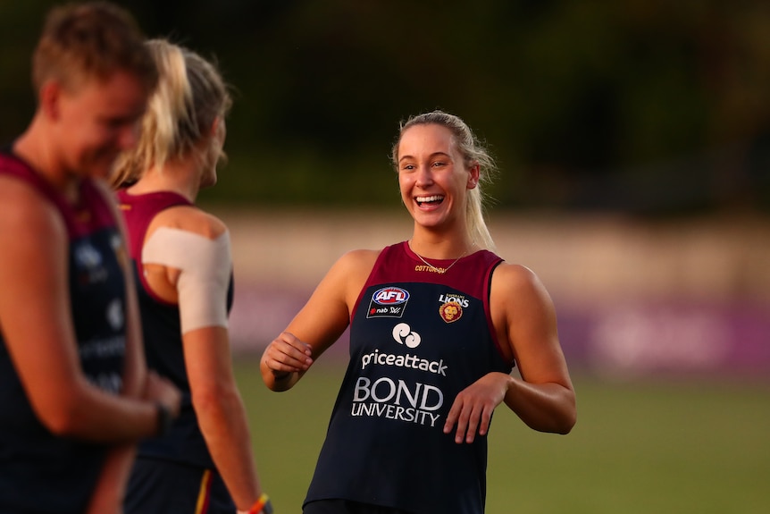 Nat Grider smiles during a training session while looking at her teammates