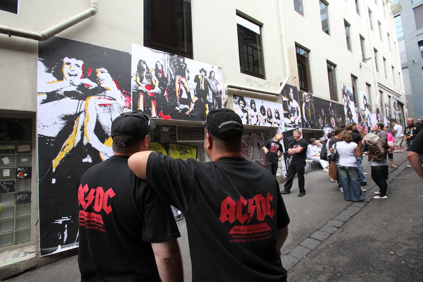 AC/DC fans congregate in AC/DC Lane in Melbourne's CBD before a concert.