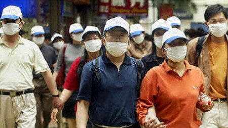 Tourists wear masks in Hong Kong